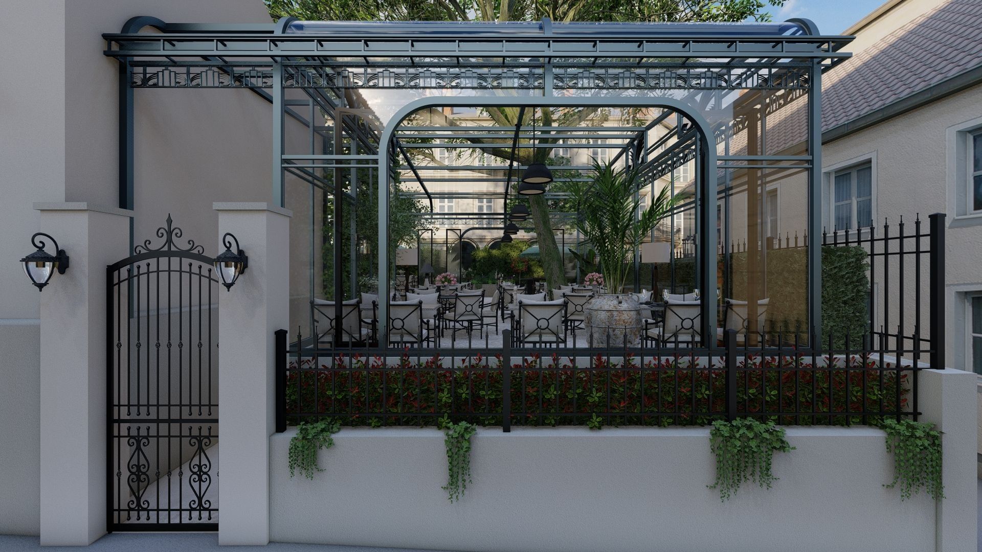 Stakleni paviljon restorana u bašti iza kovane ograde